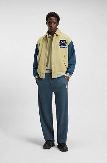 Trenirka BOSS HUGO x RB Oversized-Fit Tracksuit Bottoms with Striped Waistband and Drawstring Tamnoplava | 50549308, 1