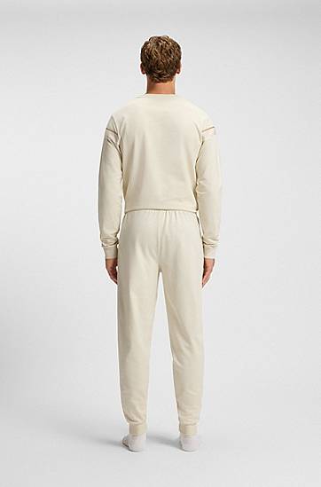 Trenirka BOSS Cotton-terry tracksuit bottoms with side tape and vertical logo Bež | 50550613, 1