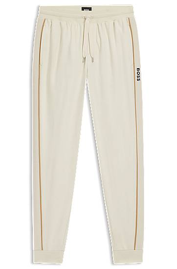 Trenirka BOSS Cotton-terry tracksuit bottoms with side tape and vertical logo Bež | 50550613, 0