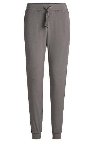 Trenirka BOSS Monogram Tracksuit Bottoms with Modal and Silk Siva | 50535841