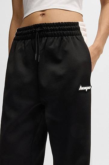 Trenirka BOSS Retro Tracksuit Bottoms with Side Stripe Crna | 50537080, 1
