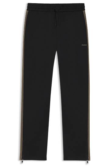 Trenirka BOSS Relaxed-fit tracksuit bottoms with logo tape and ankle zippers Crna | 50551351