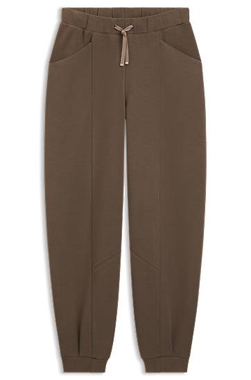 Trenerka BOSS Relaxed-fit tracksuit bottoms with lustrous piping Smeđa | 50548633