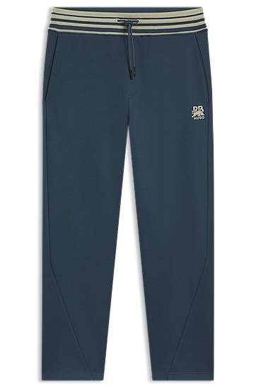 Trenirka BOSS HUGO x RB Oversized-Fit Tracksuit Bottoms with Striped Waistband and Drawstring Tamnoplava | 50549308